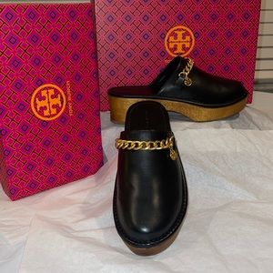 Tory Birch clogged black with gold tone, hardware tan bottom leather upper.